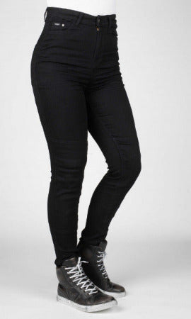 Black jeans worn by a person on a white background